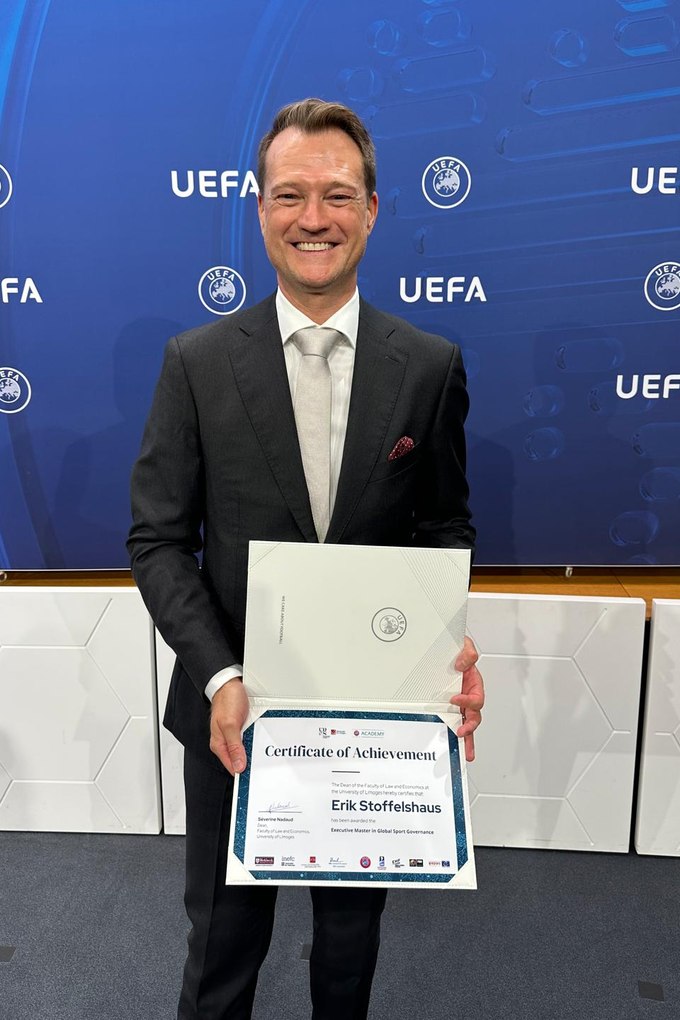 Erik Stoffelshaus receiving the MESGO Executive Master in Global Sport Governance certificate at UEFA